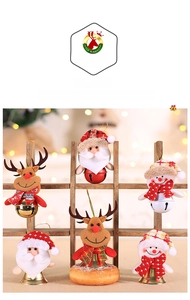 Detailed view of Christmas plush bell ornaments featuring Santa, reindeer and snowman