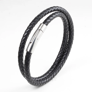 Double-layer braided black leather bracelet with silver magnetic clasp on white background