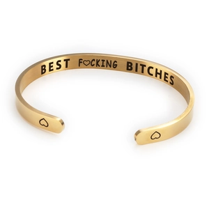Detail view of gold stainless steel cuff bracelet with Best Fucking Bitches engraving