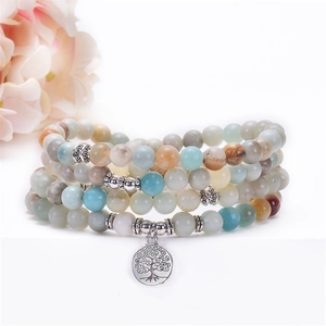 Detail of 108 mala beads with Amazonite stones and silver Tree of Life charm pendant