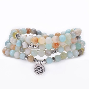 Detailed close-up of 8mm Amazonite mala beads with silver lotus flower charm pendant