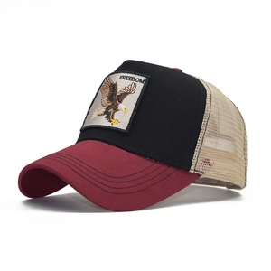 Detail of eagle embroidery and freedom patch on a breathable mesh trucker hat
