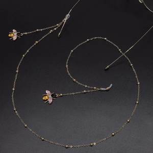 Catena per occhiali dorata alla moda con pendenti a forma di ape e anelli in silicone nero