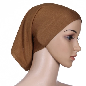 Close-up of a brown underscarf cap for women made of soft mercerized cotton fabric