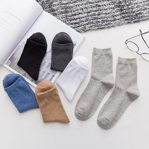 Set of men's cotton crew socks in neutral colors with minimalist Nordic style props