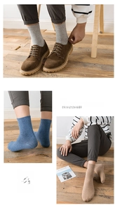 Close-up of three pairs of premium cotton crew socks in grey, blue, and beige colors