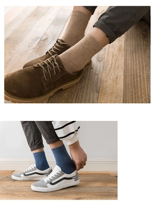 Detail of ribbed cotton blend socks in light brown and grey blue with casual footwear