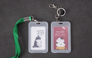 Detail view of transparent PP card holders with green lanyard and metal key ring attachments