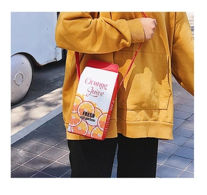 Creative juice box crossbody bag with orange juice print and vibrant color-block design