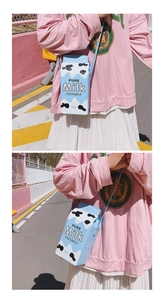 Creative blue milk carton crossbody bag with cow print pattern and Pure Milk text detail