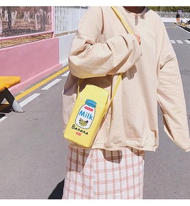 Creative yellow banana milk carton shaped PU leather shoulder bag worn by model