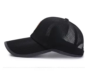 Close-up of black breathable mesh texture and side seams on outdoor baseball cap