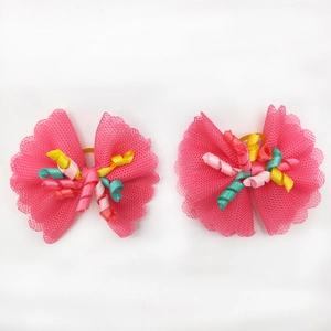 Pair of rose pink lace pet hair bows with rainbow ribbon centers and yellow elastic bands