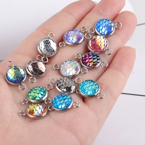 Macro shot of 10mm colorful fish scale resin pendants with stainless steel double loops