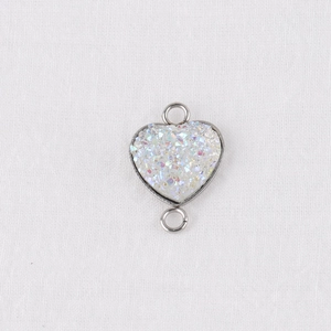 Macro shot of 13mm iridescent heart druzy connector with silver double loops for DIY jewelry