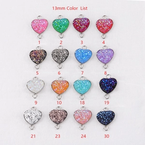 Matrix of 16 colorful 13mm heart-shaped glitter resin pendants for DIY jewelry