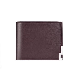 Close-up of litchi texture brown leather wallet featuring a silver geometric metal accent