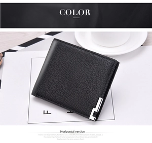Detail of horizontal men's black lychee pattern leather wallet with metal accent