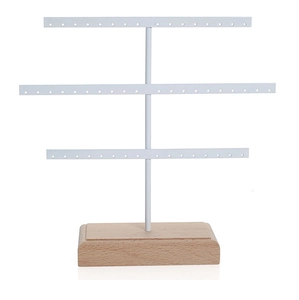 Detailed view of 3-tier white metal jewelry stand with solid wood base and earring holes