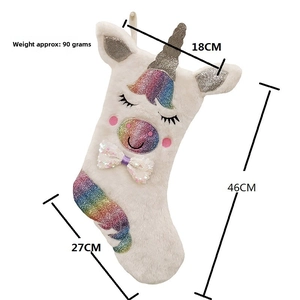 Detail view of large unicorn Christmas stocking with dimensions 46cm height and 27cm length