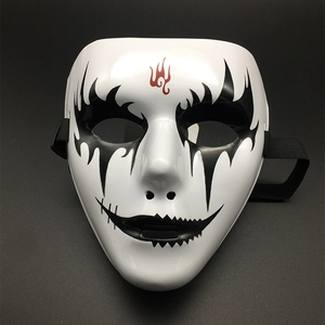 Detail showing hand-painted black eye patterns and red flame totem on white full face mask