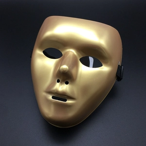 Detail of a metallic gold full face masquerade mask with smooth finish and elastic bands