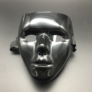 Detail of glossy black full face dance mask with elastic strap and breathing holes
