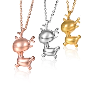 Detailed view of three polished stainless steel deer pendants in gold, silver, and rose gold