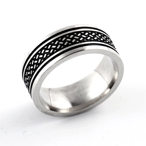 Close-up of 8mm stainless steel ring with black braided vintage fish pattern texture