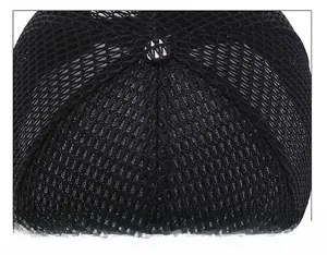Close-up of durable top stitching and breathable mesh fabric on a black baseball cap