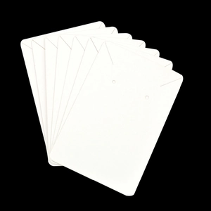 White paper jewelry display cards for necklaces and earrings in fan-shaped stack