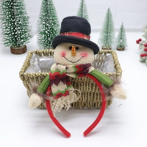 Plush snowman headband for Christmas party with red plaid scarf on wicker basket