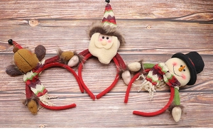 Detailed view of Christmas headbands featuring reindeer, Santa and snowman on wood