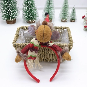 Festive reindeer headband with red scarf in a woven basket for Christmas party decor