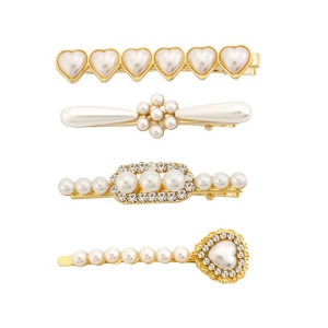 Detailed view of 4-piece gold pearl hair clip set with hearts and floral crystal patterns