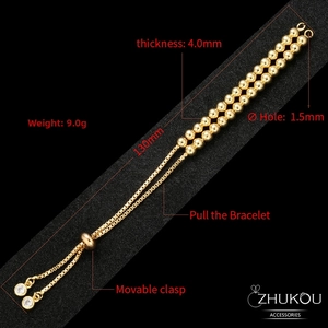 Detail of adjustable copper bead bracelet with 18K gold finish and cubic zirconia charms