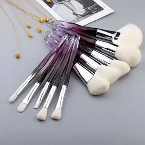 Detail of 10-piece makeup brush set with purple crystal handles and white soft bristles