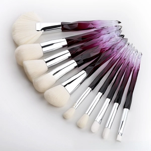 Detail of 10pcs crystal makeup brushes with purple diamond cut handles and soft white bristles