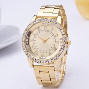 Close-up of golden quartz watch with crystal-encrusted bezel and Roman numeral markers