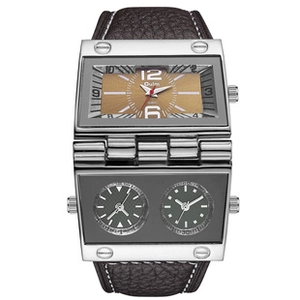 Detail of silver rectangular dual-dial watch with Oulm logo and brown leather strap