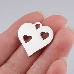 Polished silver hollow heart pendant in stainless steel with triple cutout design