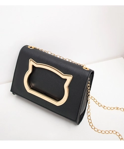 Close-up of black PU leather crossbody bag featuring a golden cat-ear metal decoration