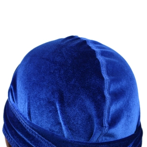 Close-up of seamless stitching and glossy velvet texture on a navy blue durag