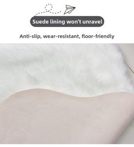 Detail of white plush rug with non-slip suede backing and wear-resistant stitching