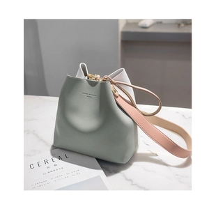 Three-tone bucket bag in green, white and pink with stylish wide leather shoulder strap