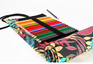 Detail of printed canvas pencil roll organizer with tropical leaf pattern and elastic slots