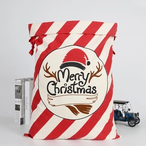Close-up of a red and white striped Christmas canvas gift bag with Merry Christmas print