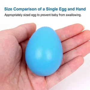 Blue solid wood Easter egg toy for DIY painting shown in hand for scale and safety size