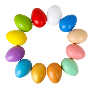 Set of 12 colorful wooden Easter eggs arranged in a circle for DIY painting and play