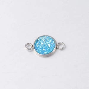 Macro detail of 10mm light blue druzy stone connector in stainless steel setting
